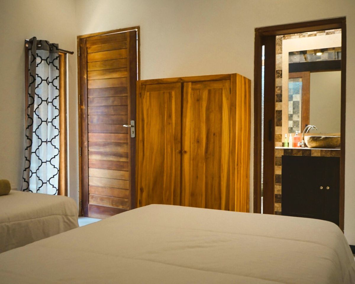 Shared room bamboo cottage exterior and bed